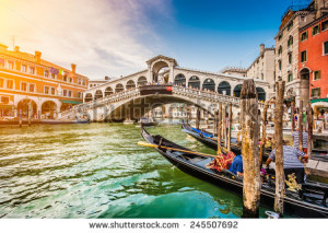 stock-photo-panoramic-view-of-famous-canal-grande-from-famous-rialto-bridge-at-sunset-in-venice-italy-with-245507692
